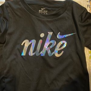 Nike flowy shirt high in the front longer in the back.
